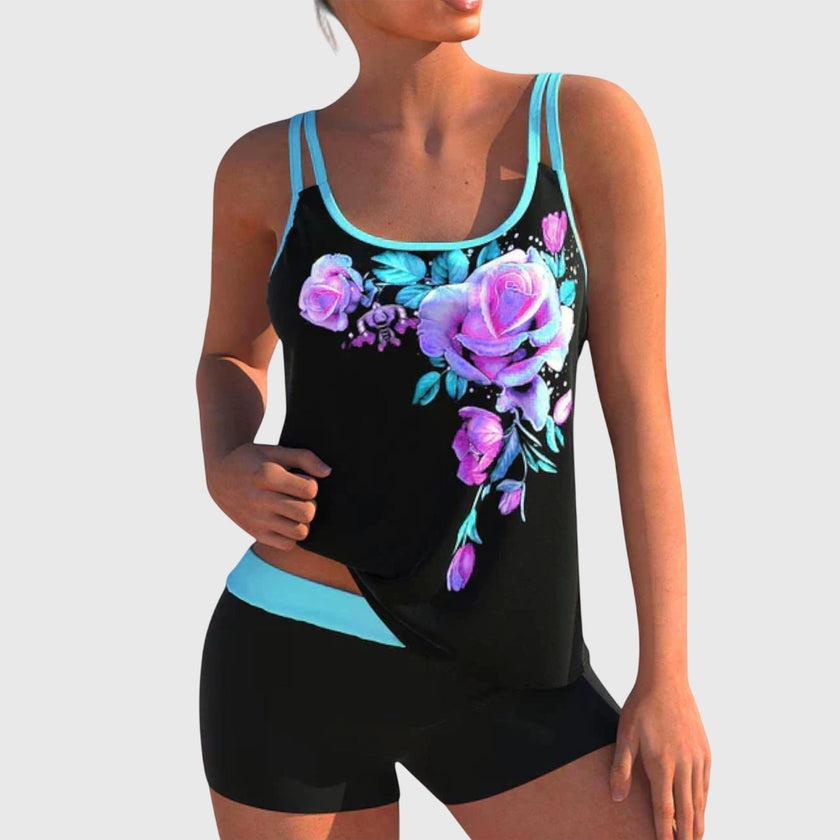 Women's floral tankini set with contrast trim and boy shorts from FJØRNA, featuring a colorful floral print and sporty design.