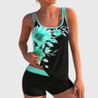 Women's floral tankini set with contrast trim and boy shorts, featuring a colorful floral placement print by FJØRNA.