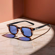 FJØRNA women's tortoiseshell sunglasses with blue mirrored lenses and UV protection, stylish eyewear for sunny days.