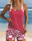 Women's two-piece tankini swimsuit by FJØRNA with floral swim shorts, featuring a tankini top and colorful floral pattern.