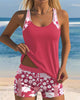 Women's two-piece tankini swimsuit by FJØRNA with floral swim shorts, featuring a tankini top and colorful floral pattern.