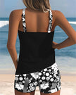 Women's two-piece tankini swimsuit by FJØRNA with floral swim shorts, featuring a supportive tankini top and vibrant floral pattern.