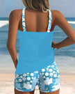 Women's two-piece tankini swimsuit by FJØRNA with floral swim shorts, featuring a tankini top and colorful floral shorts.