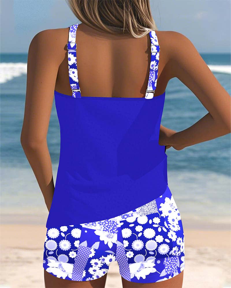 Women's two-piece tankini swimsuit with floral swim shorts by FJØRNA, shown with tankini top and matching floral shorts.