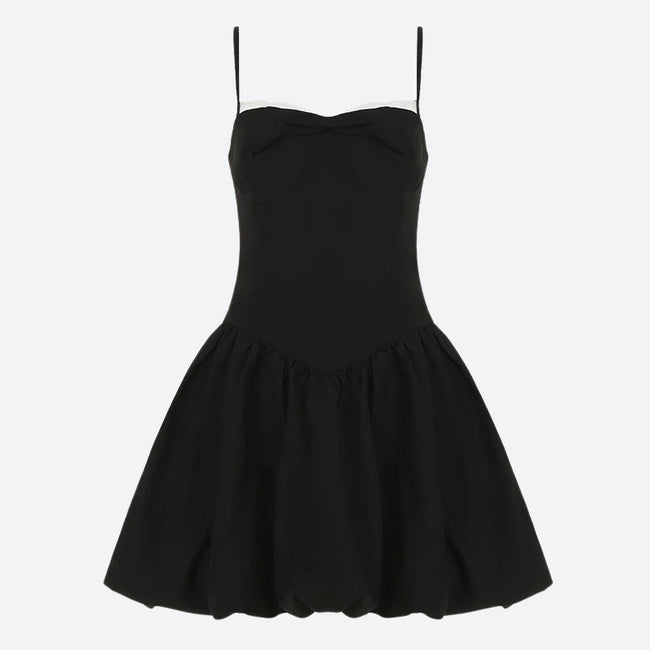 FJØRNA Y2K Bow Bubble mini dress featuring a playful bow design, ideal for party and daytime wear, shown on a model.