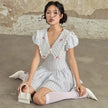 FJØRNA Y2K Chelsea collar mini dress featuring a fitted silhouette, short sleeves, and retro-inspired design.