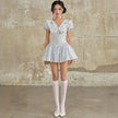 FJØRNA Y2K Chelsea collar mini dress featuring a fitted silhouette, short sleeves, and retro-inspired style.