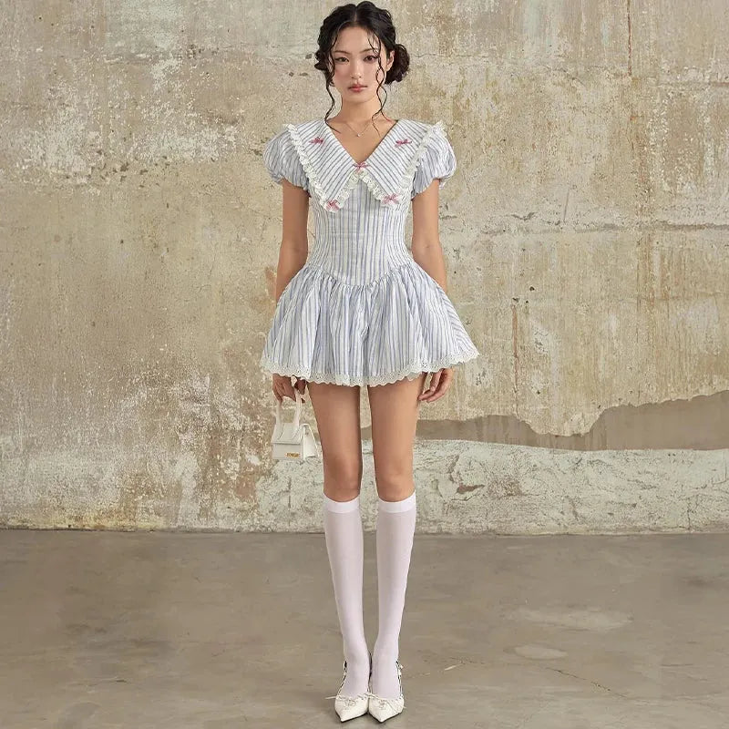 FJØRNA Y2K Chelsea collar mini dress featuring a fitted silhouette, short sleeves, and retro-inspired style.
