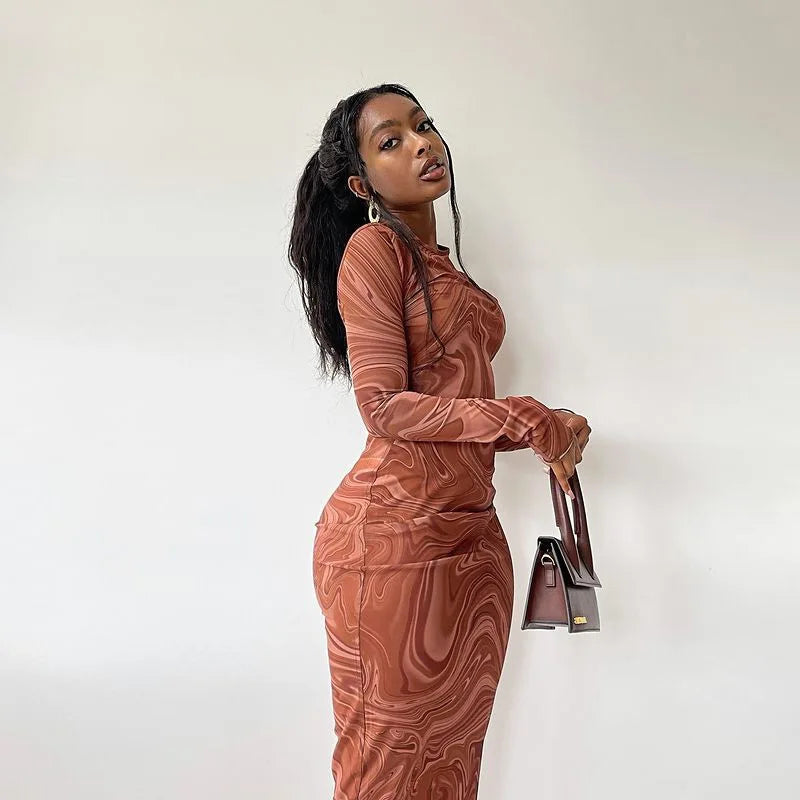 FJØRNA Y2K Marble Swirl Maxi Dress featuring a flowing silhouette and vibrant marble pattern, perfect for stylish occasions.
