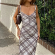 FJØRNA Y2K plaid slip midi dress for women, featuring a stylish plaid pattern and versatile day-to-night wear.