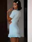 FJØRNA Y2K ribbed mini dress featuring a fitted silhouette and vibrant color, perfect for trendy, retro-inspired fashion.
