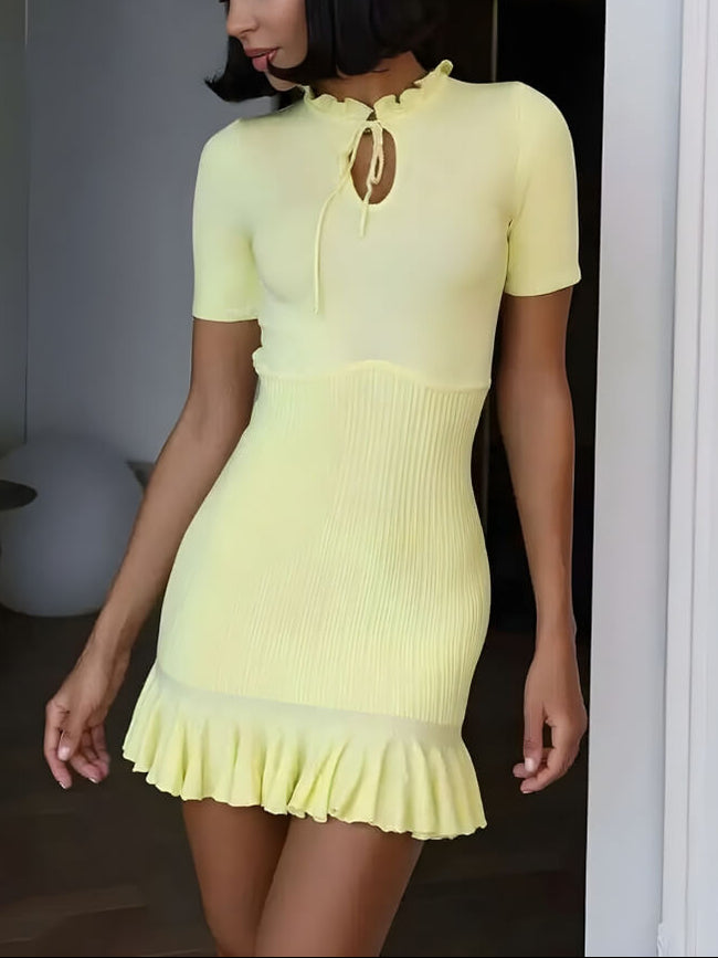 FJØRNA Y2K ribbed women's mini dress featuring a fitted style, perfect for party or daytime wear, shown on a model.