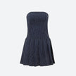 FJØRNA Y2K striped strapless mini dress with bold colorful horizontal stripes, sleeveless design, and fitted silhouette.