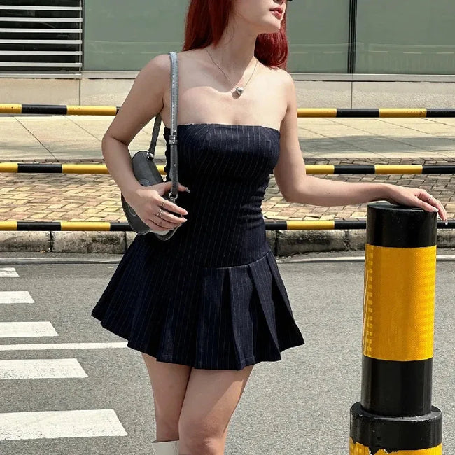 FJØRNA Y2K striped strapless mini dress for women, featuring bold horizontal patterns, perfect for party and daytime wear.