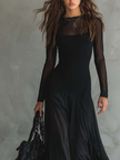 Flowy tulle maxi dress for women by FJØRNA, featuring elegant, lightweight fabric and a graceful silhouette.