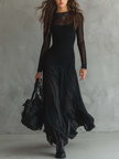 Elegant women's maxi dress by FJØRNA featuring a flowy tulle design, perfect for formal or special occasions.