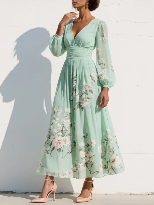 FJØRNA women's summer midi dress with floral pattern, V-neckline, and flowy fabric, perfect for warm weather.