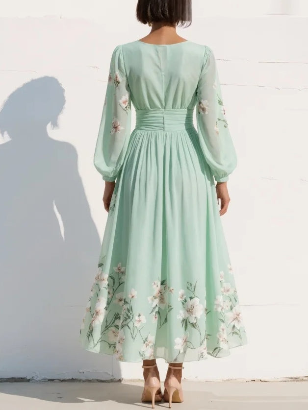 FJØRNA women's floral summer midi dress with a V-neck, flowy fabric, and a stylish design perfect for warm weather.