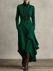 Green FJØRNA summer maxi dress for women with high neck and long sleeves, flowing and elegant for warm weather.