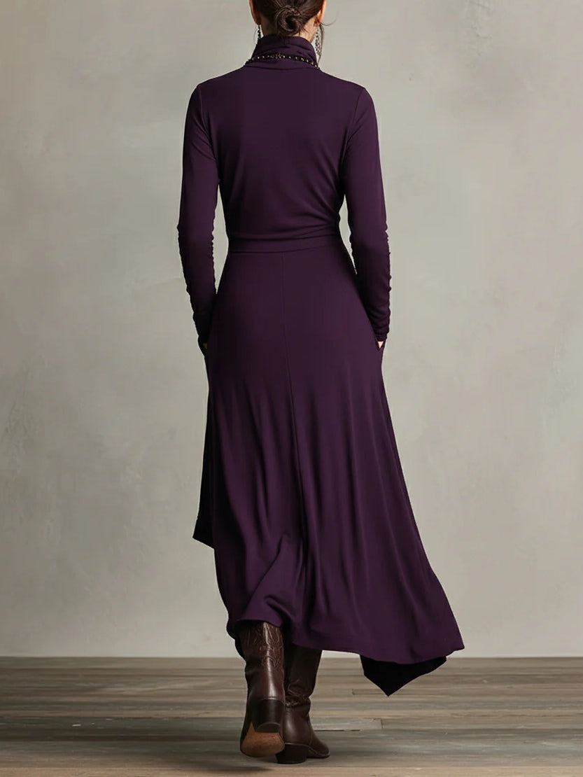 FJØRNA summer maxi dress for women with high neck and long sleeves, flowing fabric in a vibrant floral pattern.