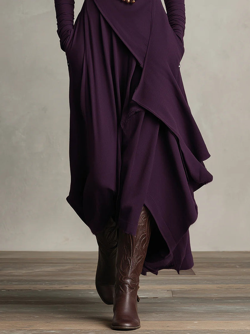 FJØRNA summer maxi dress for women with high neck and long sleeves, flowing fabric, in a vibrant color, suitable for warm weather.