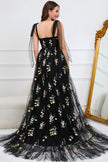 Black FJØRNA Macy tulle A-line evening dress with elegant flowy fabric and intricate detailing, perfect for formal occasions.