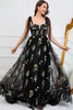 FJØRNA Macy trendy tulle A-line evening dress in black, featuring elegant flowing fabric and a stylish silhouette.