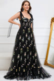 FJØRNA Macy trendy tulle A-line evening dress in black, elegant design with flowing fabric and intricate detailing.
