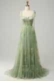 FJØRNA Macy trendy tulle A-line evening dress in vibrant green, featuring a fitted bodice and flowing skirt.