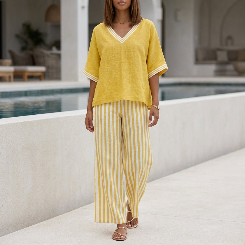 Yellow striped high-waist two-piece summer set for women by FJØRNA, featuring a stylish co-ord outfit with a crop top and matching skirt.