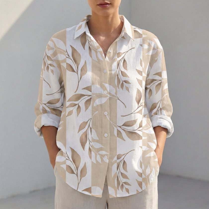 Yellow women's tunic shirt by FJØRNA with V-neck, collared neck, and roll-tab sleeves, styled as a casual top.