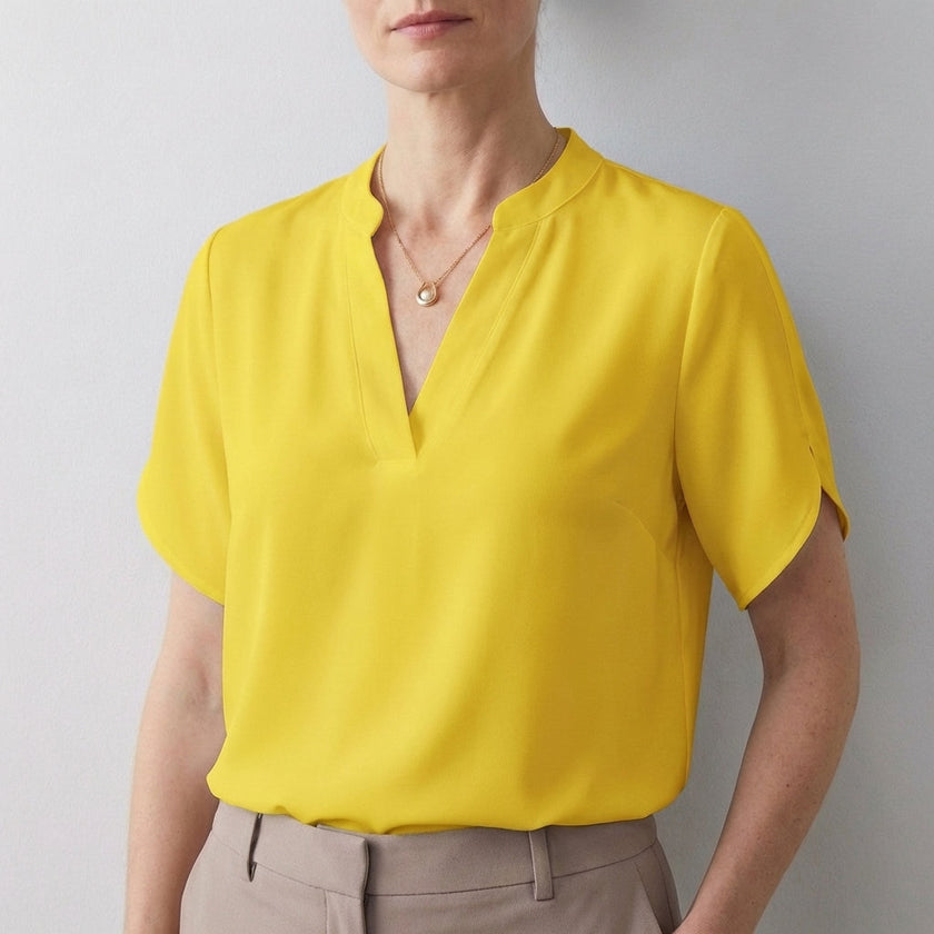 Yellow women's summer blouse by FJØRNA featuring a V-neck, short sleeves, and a flowy, breezy fit.