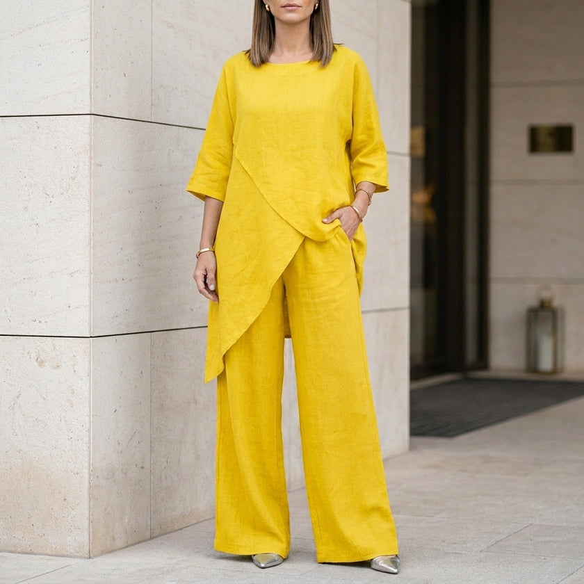 Yellow FJØRNA relaxed two-piece set with flowing wide-leg pants, stylish and comfortable for casual or elegant wear.