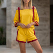 FJØRNA yellow sporty contrast trim two-piece set with relaxed off-shoulder top, casual and stylish for active wear.