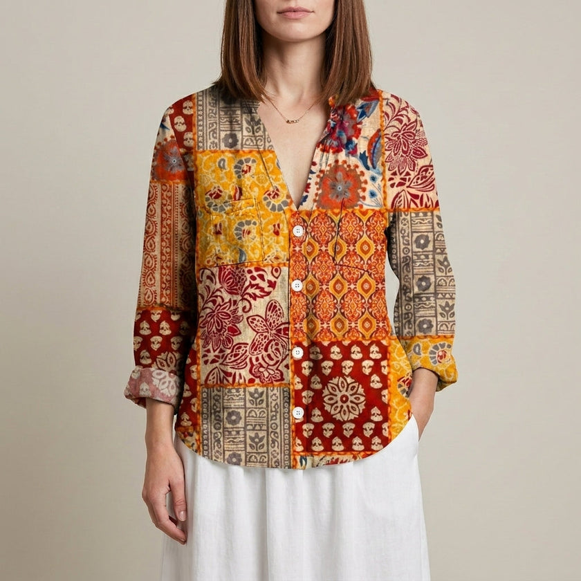 Yellow floral V-neck long sleeve linen summer blouse for women by FJØRNA, shown on a model.