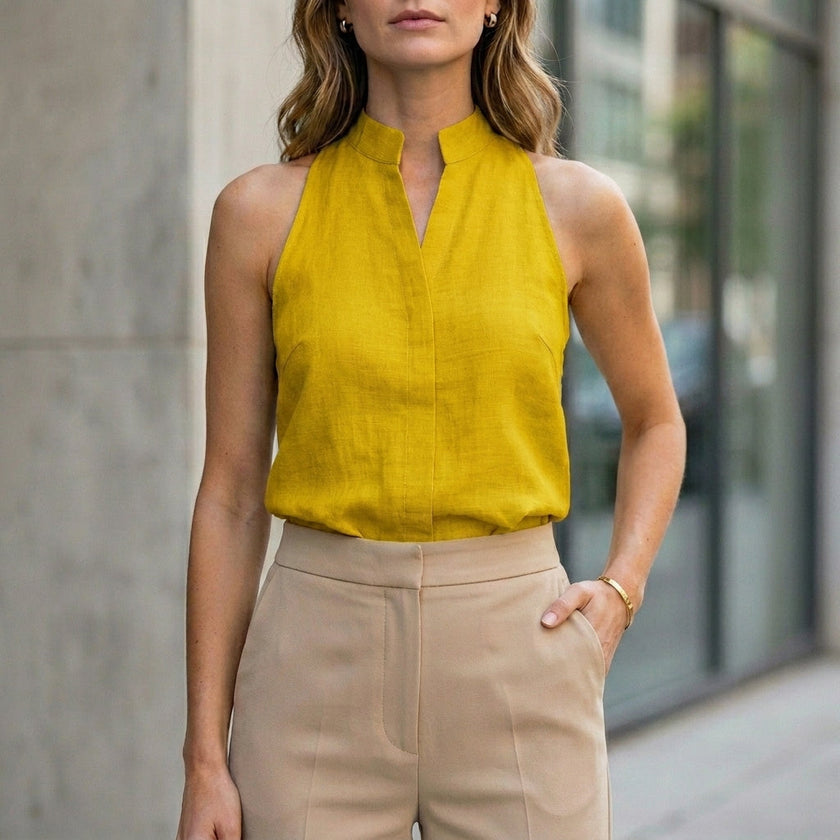 FJØRNA women's sleeveless yellow denim summer blouse with a relaxed fit, perfect for warm weather and casual outfits.