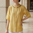 Yellow linen summer blouse for women with ruffle details, stylish FJØRNA top perfect for warm weather.