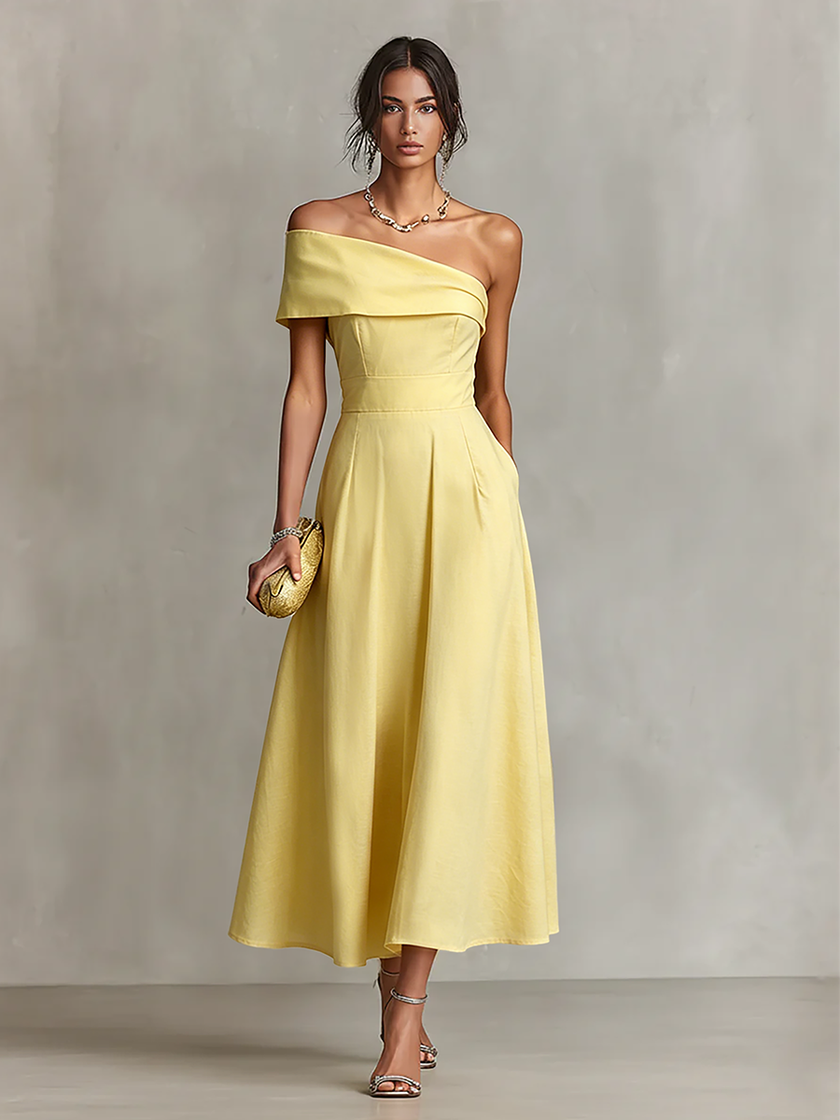 Yellow linen evening dress by FJØRNA, flowing fabric with a fitted bodice and elegant drape, perfect for formal occasions.