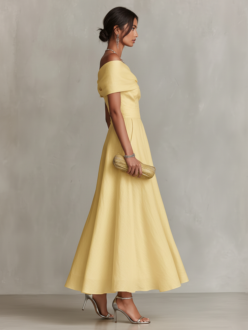Yellow linen evening dress by FJØRNA, sleeveless with a flowing fit and elegant design, perfect for warm-weather occasions.