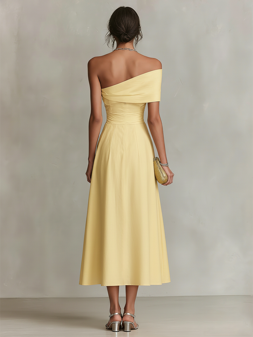 Yellow linen evening dress by FJØRNA, featuring a flowy design with elegant shoulder straps and a relaxed fit.