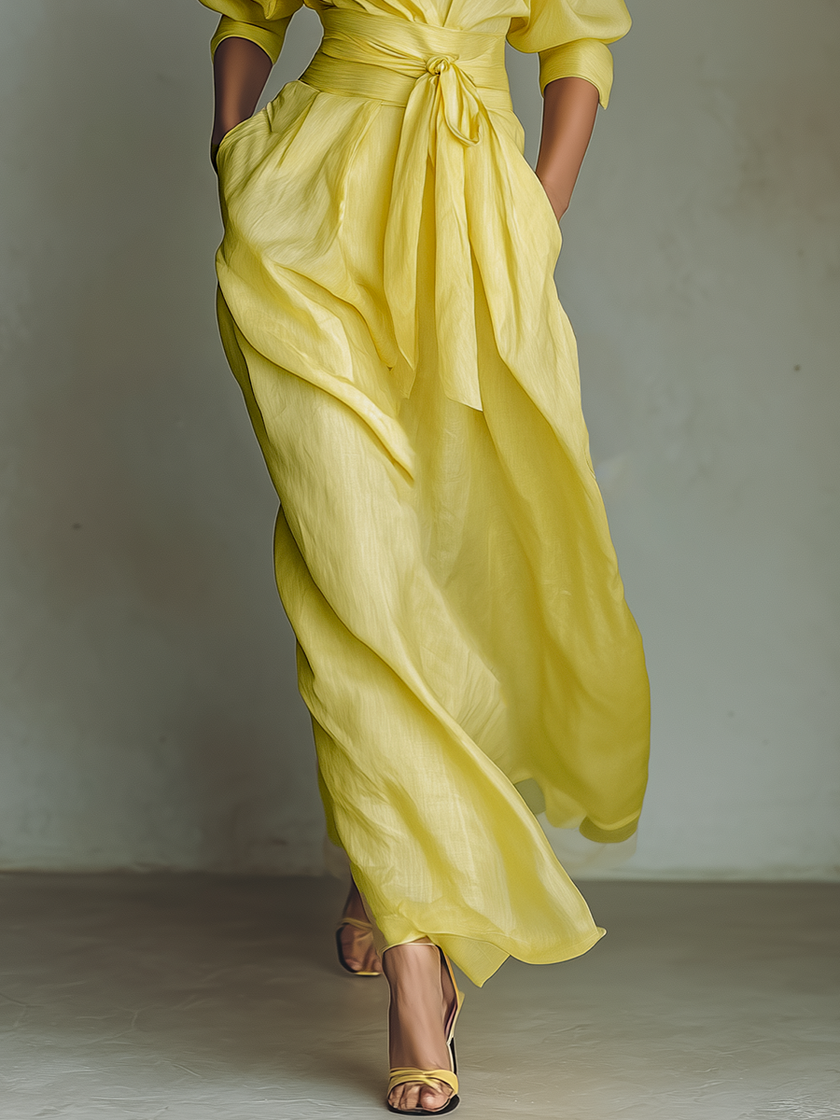 Yellow linen maxi dress for women by FJØRNA featuring a flowing silhouette and sleeveless design.