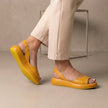 Yellow FJØRNA women's orthopedic wedge sandals with adjustable straps, featuring a comfortable and supportive design.
