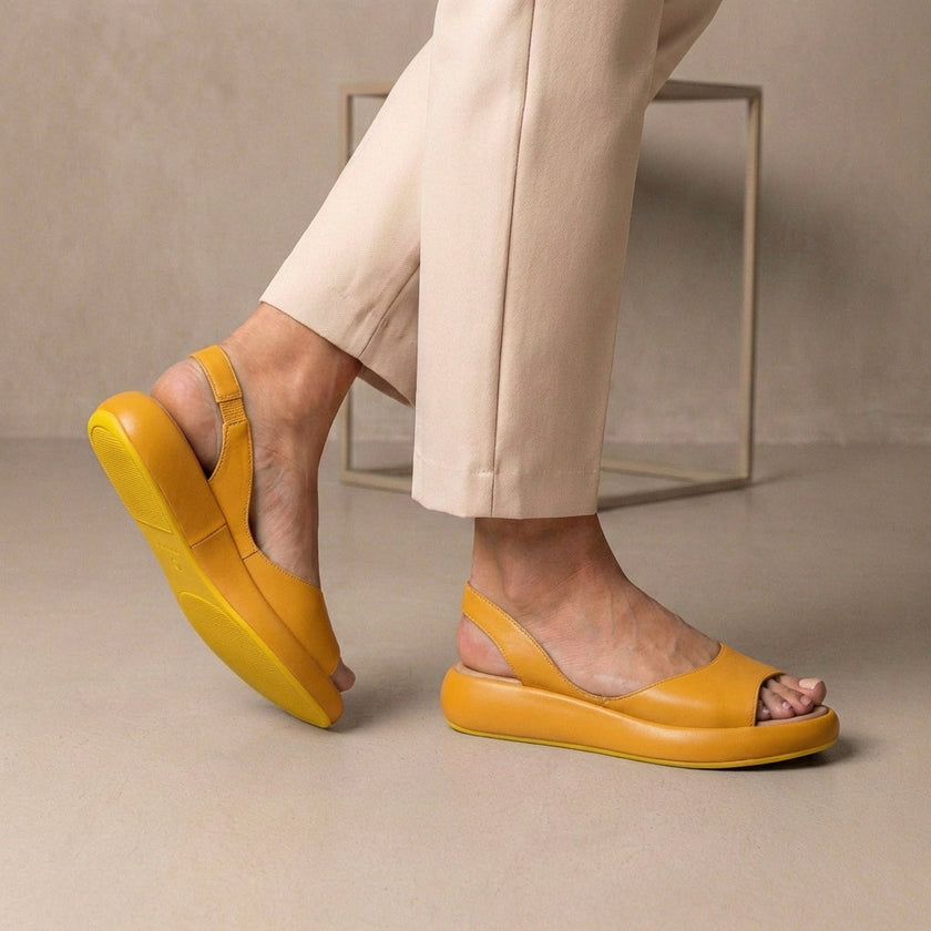 Yellow FJØRNA women's orthopedic wedge sandals with adjustable straps, featuring a comfortable and supportive design.