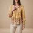 Yellow floral long sleeve linen blouse for women by FJØRNA, featuring a lightweight and stylish summer top.