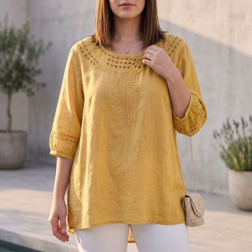 Yellow linen summer blouse for women by FJØRNA featuring stylish cut-out details and a relaxed fit.