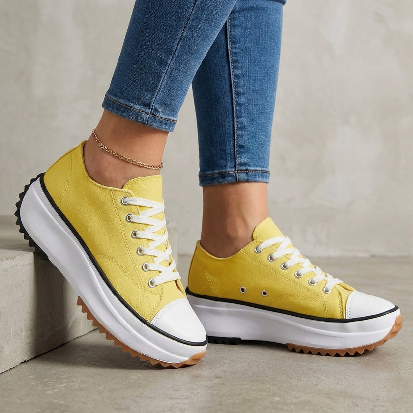 Yellow FJØRNA women's orthopedic sneakers with lace-up design, comfortable and supportive footwear for everyday wear.