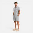 Men's textured zip polo shirt and shorts set in summer style, by FJØRNA, featuring a zip neck and casual fit.