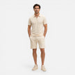 Men's textured zip polo shirt and shorts set by FJØRNA, perfect for summer casual wear, shown in a stylish coordinated outfit.