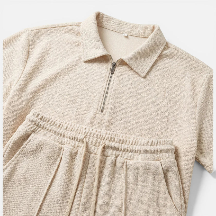 Men's textured zip polo shirt and shorts set in neutral tones, styled for summer casual wear, by FJØRNA.