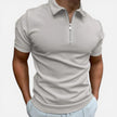 Men's slim fit zip polo shirt from FJØRNA with a classic collar and short sleeves, styled casually.